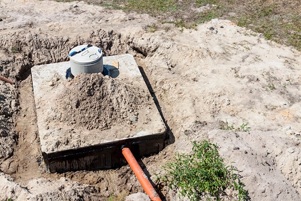 signs that your septic tank needs pumping include slow drains and odors coming from the drains